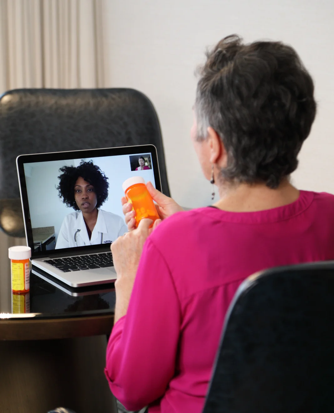 client showing medications to nurse on video call